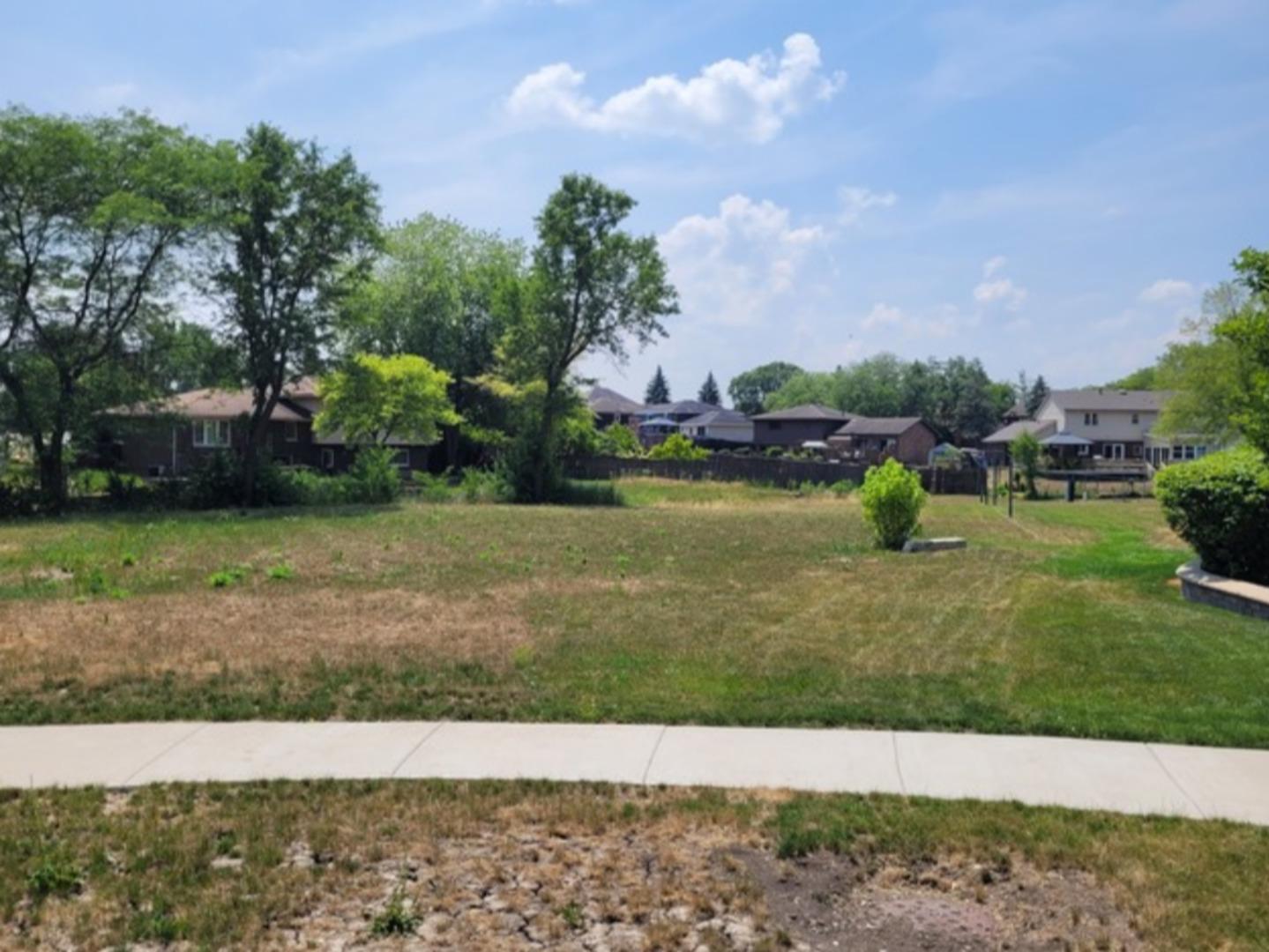 a view of a garden with houses