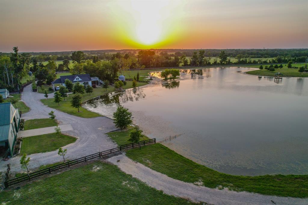 a view of a lake with houses in the back