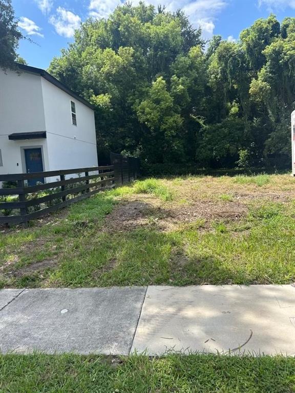 a view of backyard with green space