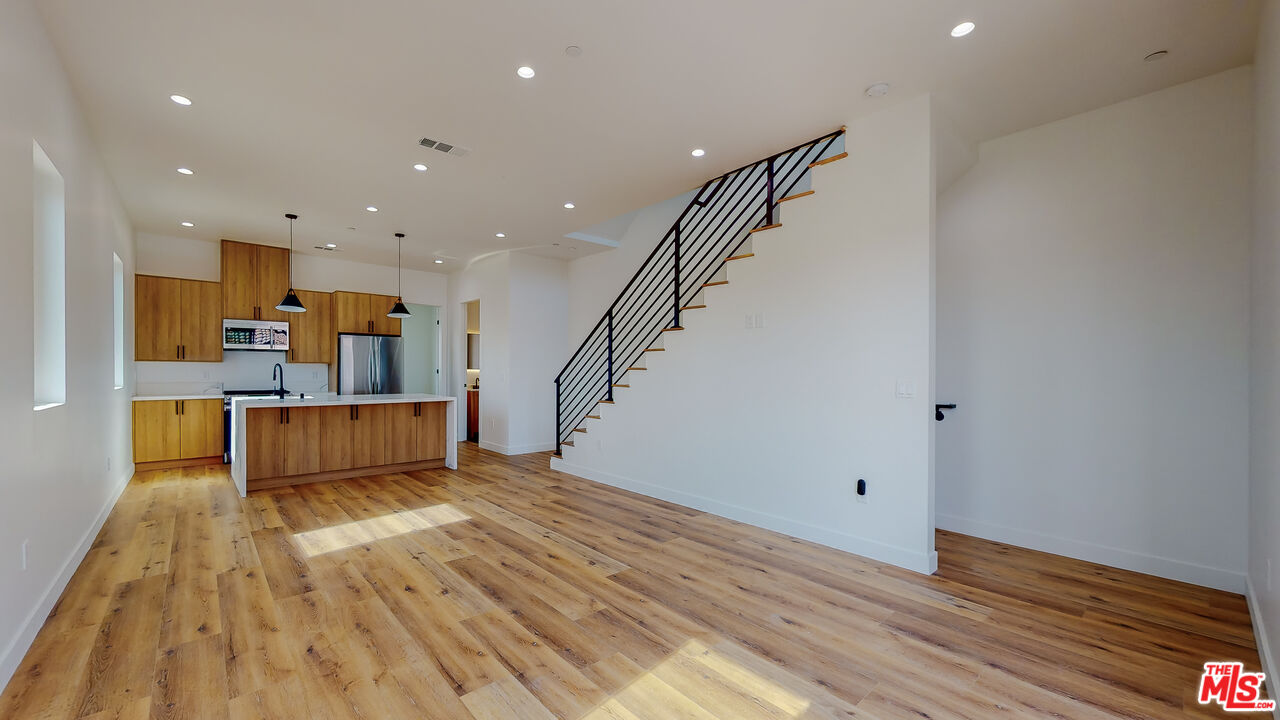 a view of kitchen and wooden floor