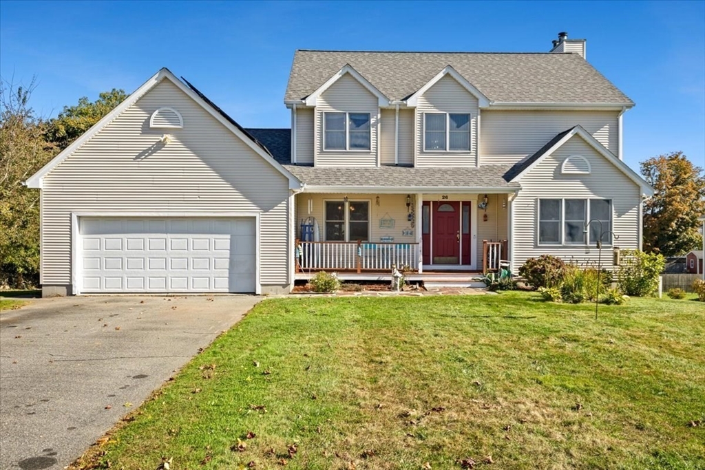 a front view of a house with a garden and porch