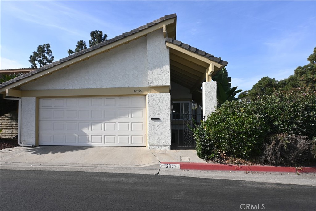 a front view of a house with a garage