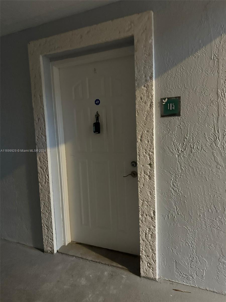 an empty room with wooden door