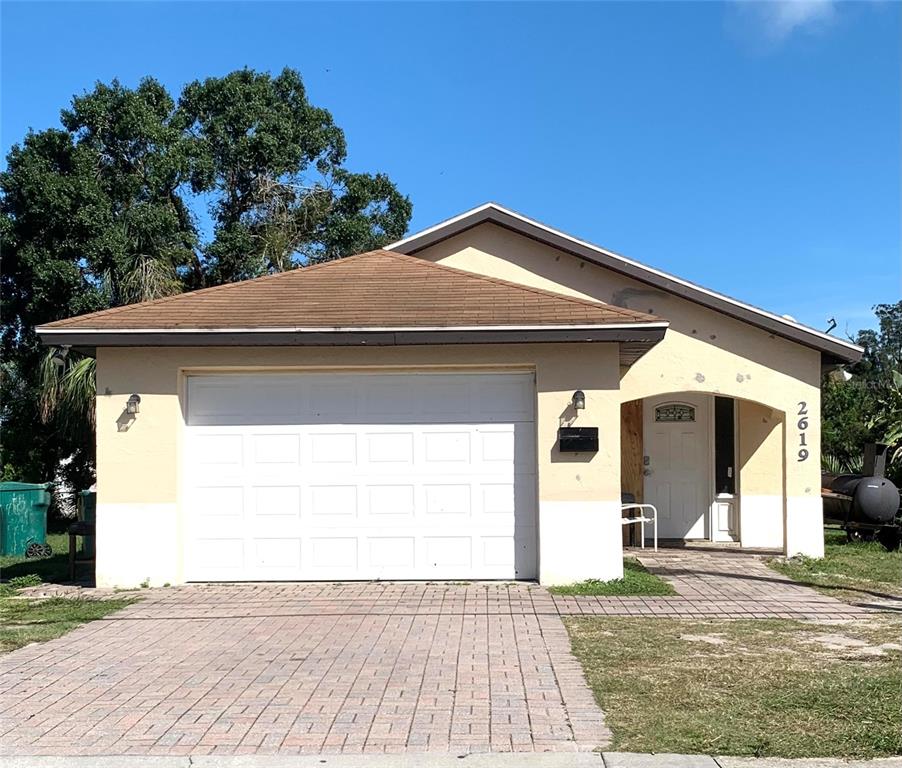 a front view of a house with a garage