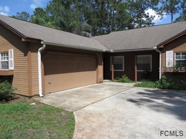 a house with white door of garage