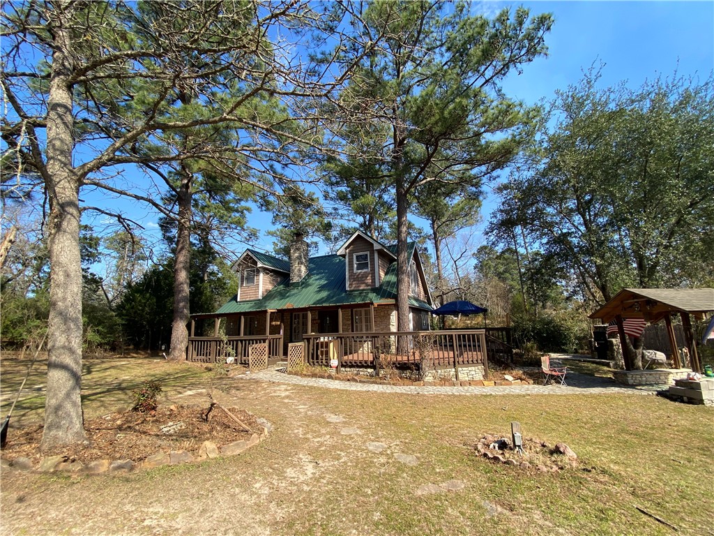 a front view of a building with trees