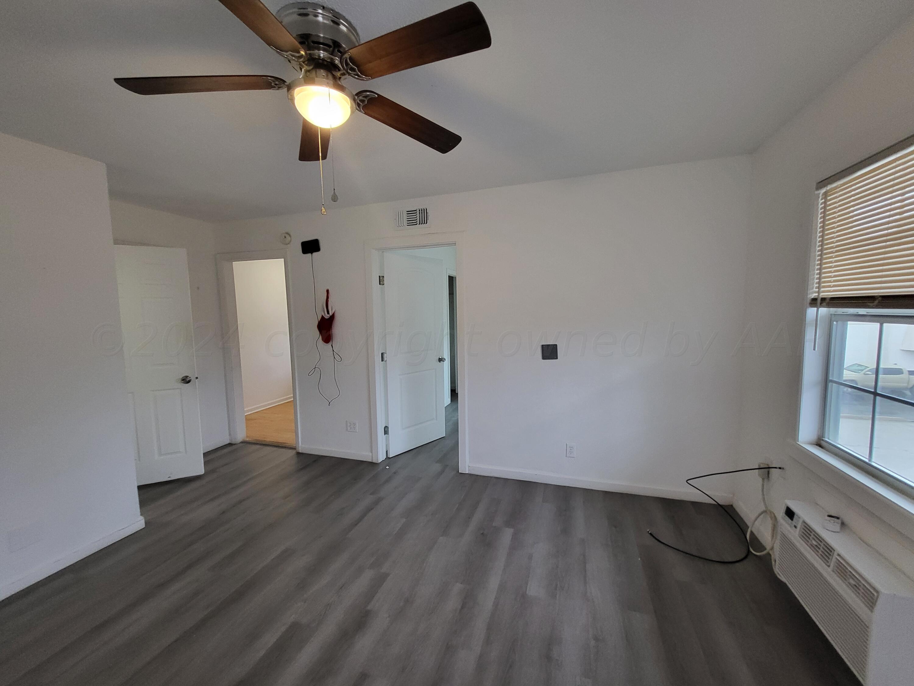 a view of a hardwood floor in a room