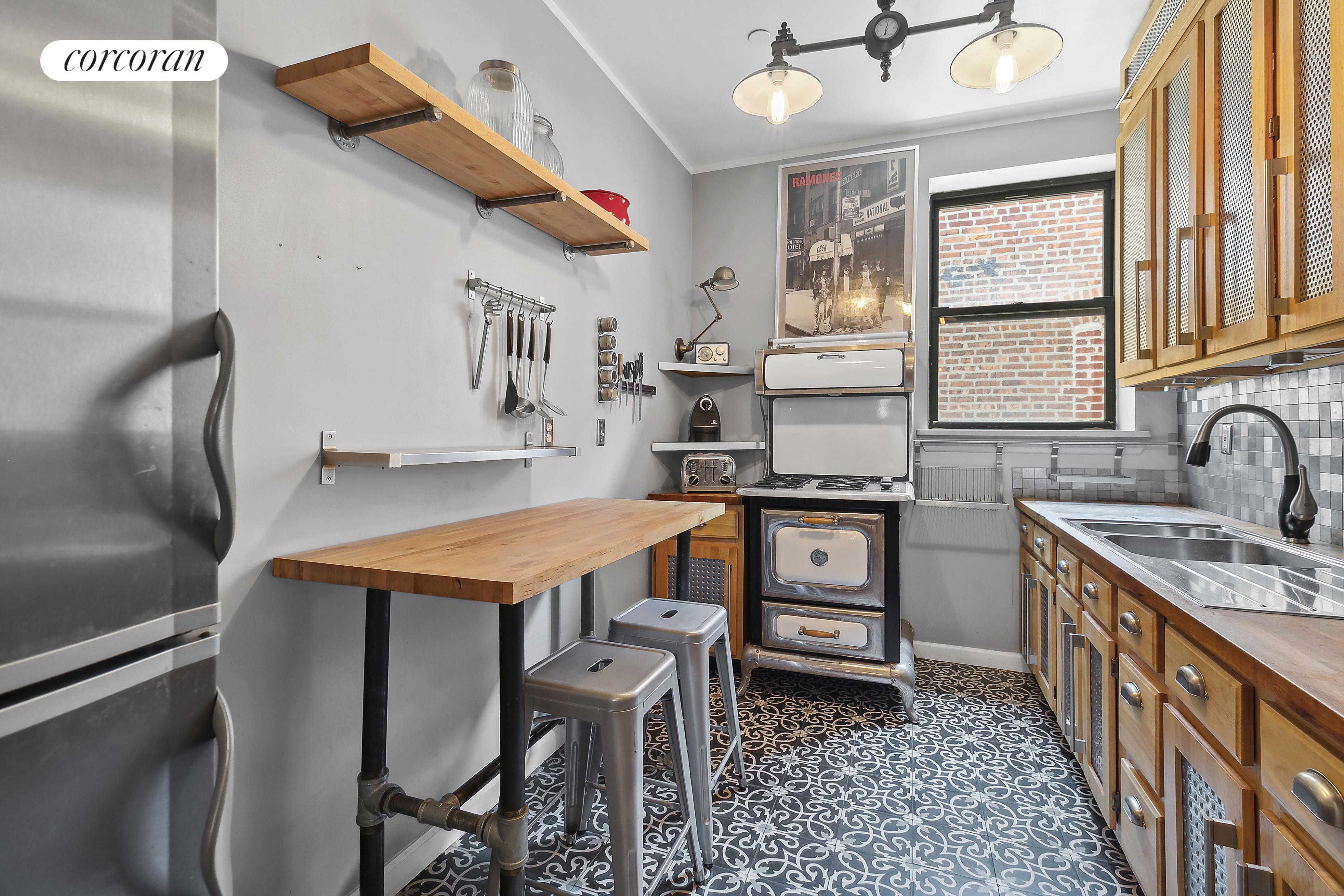 a kitchen that has a table and chairs in it