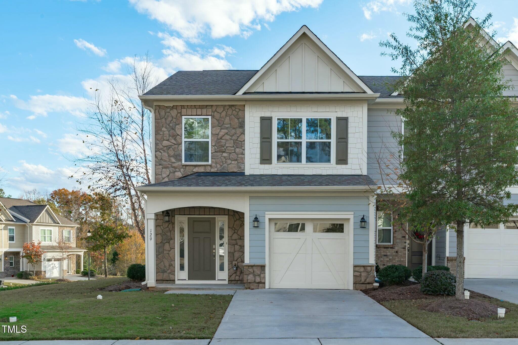 front view of a house with a yard