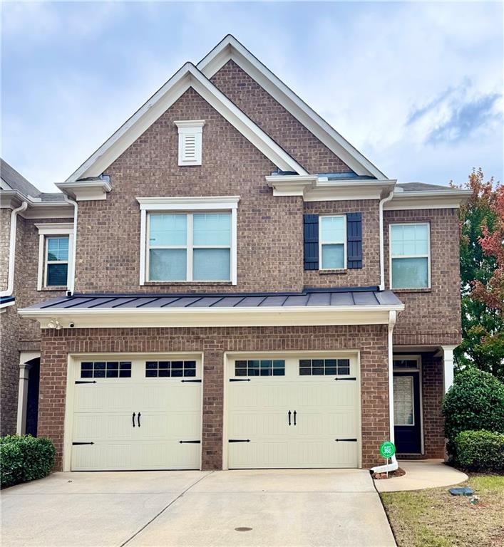 a front view of a house with a garage