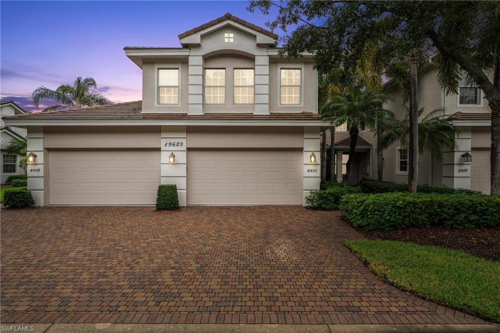 View of property featuring a garage