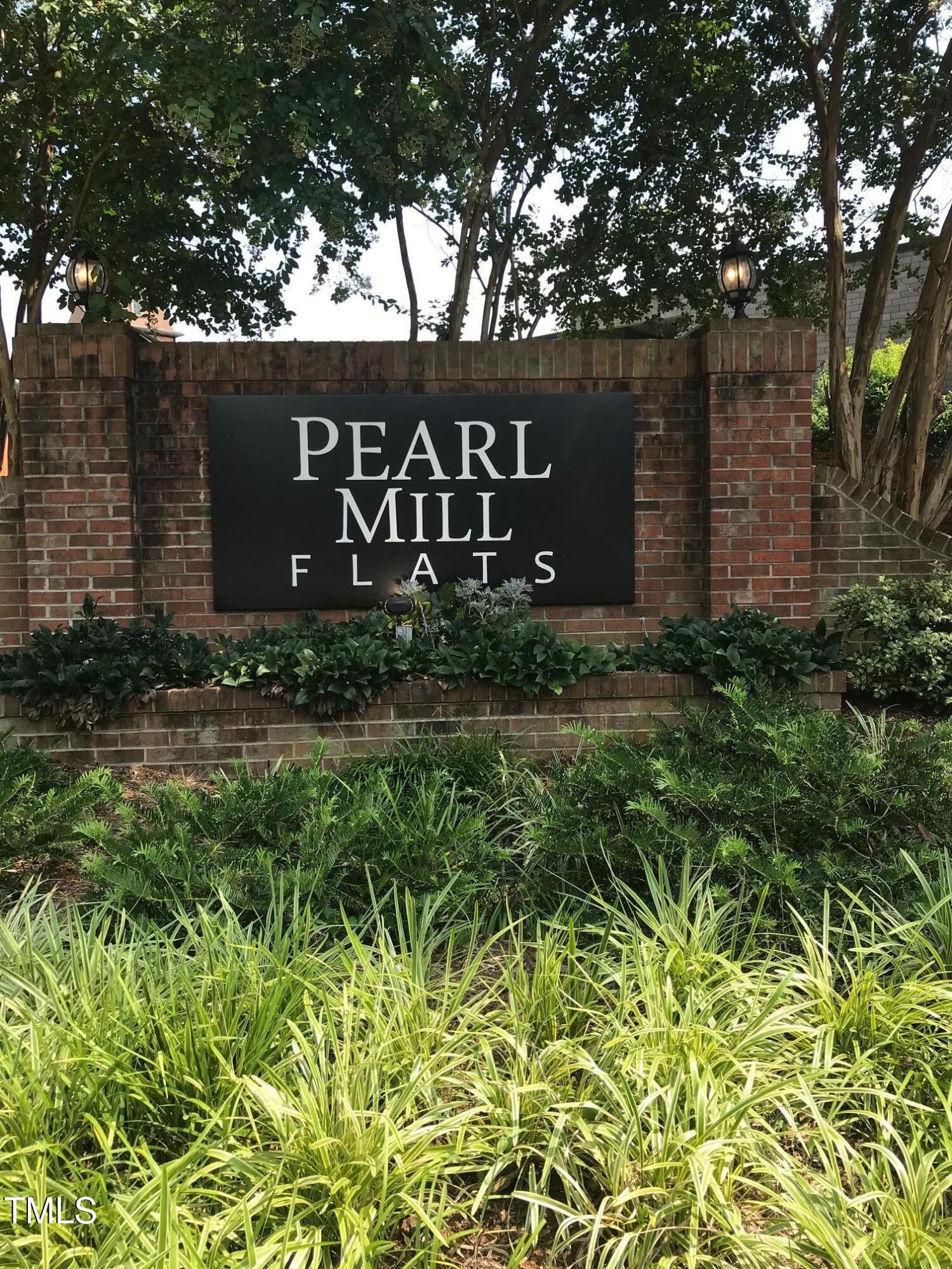 a sign broad in front of flowers