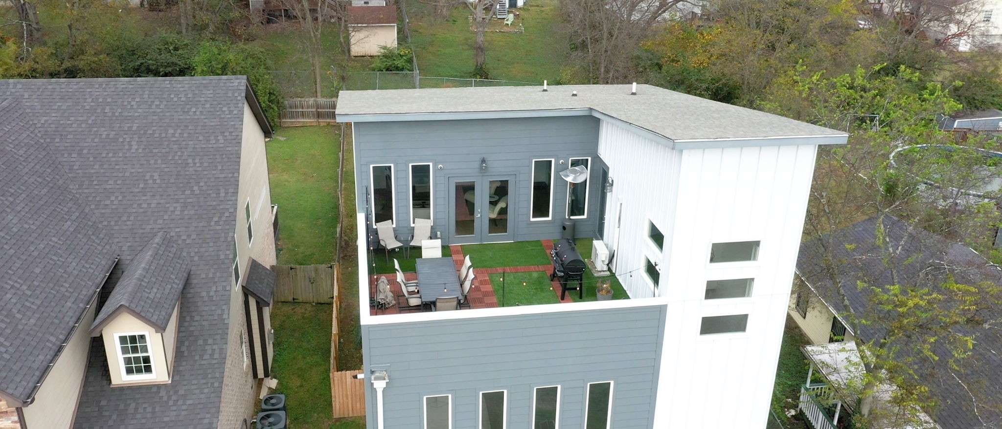 a aerial view of a house with a yard