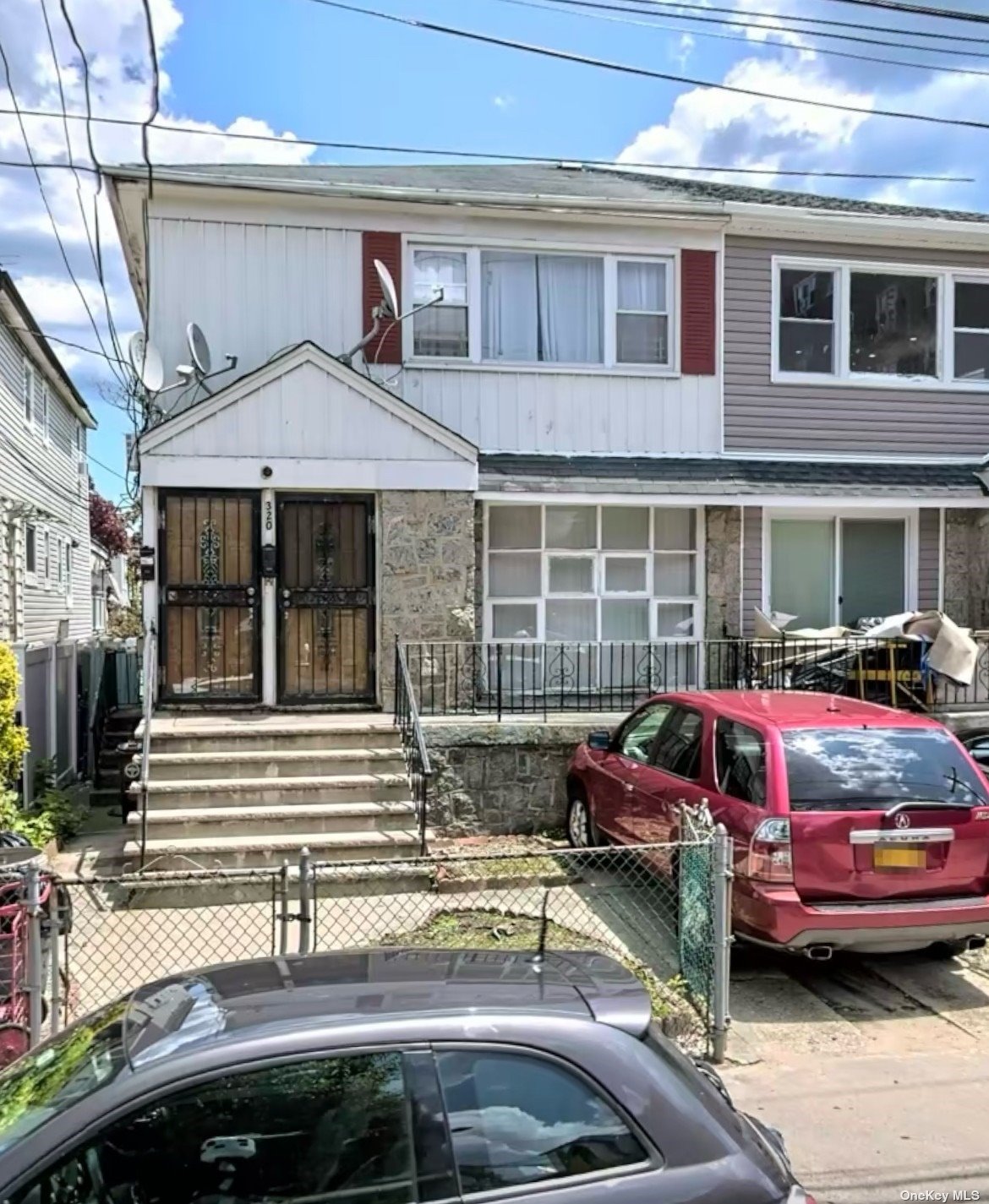 a front view of a house with parking space