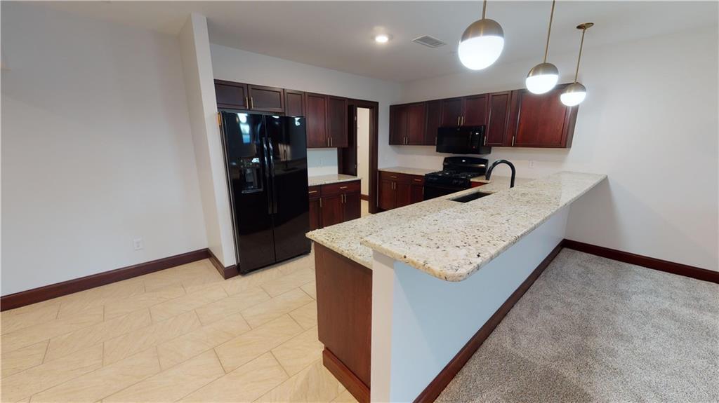 a view of kitchen island with cabinets