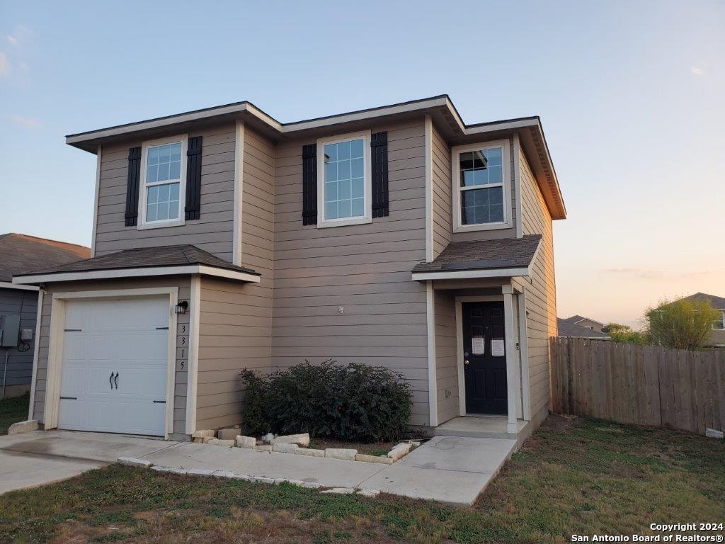 a front view of a house with yard