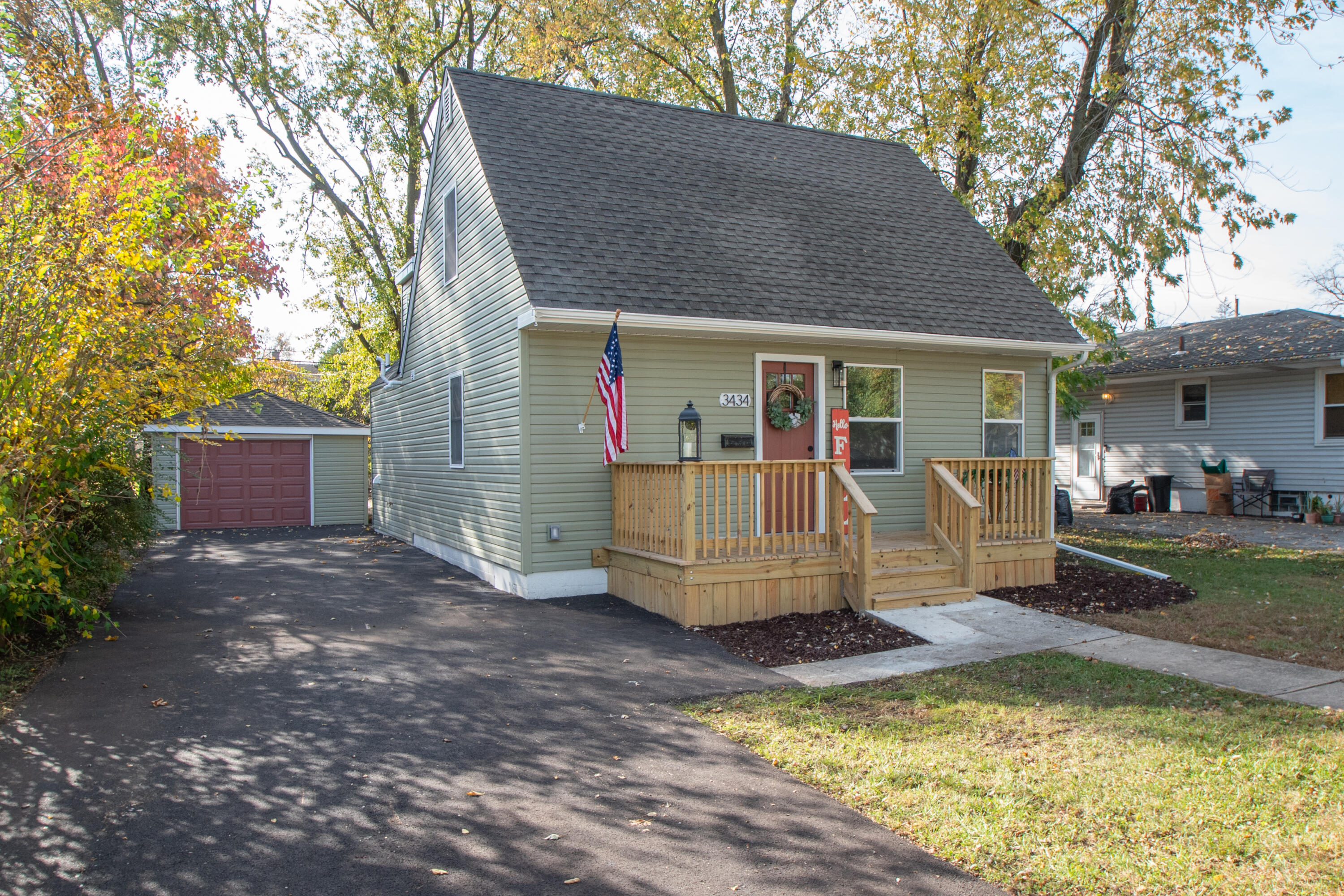 a view of a house with backyard porch and sitting area