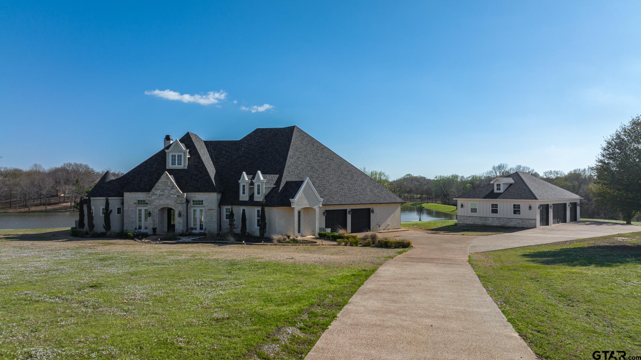 a view of a house with a big yard