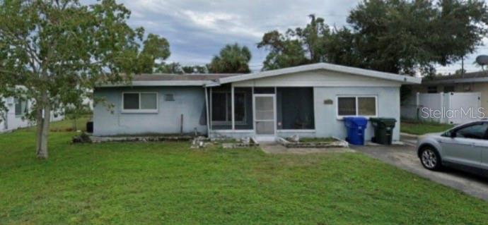 a view of a house with a backyard