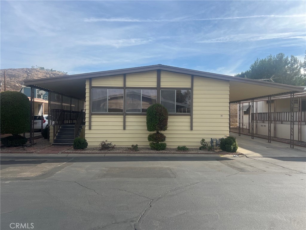 a front view of a house with garage