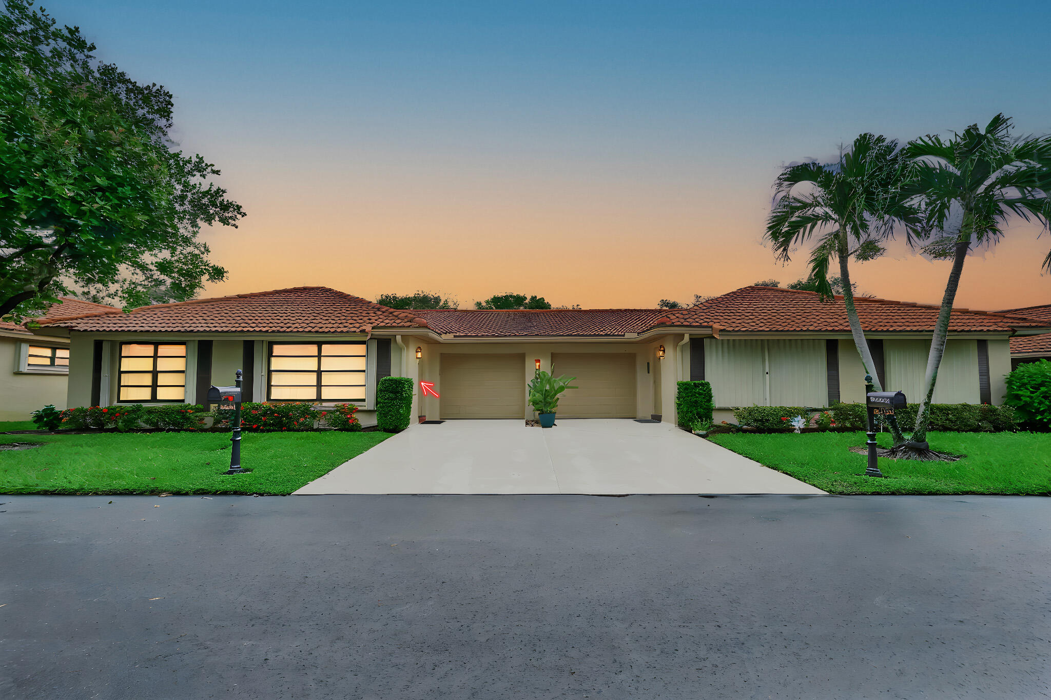 a house with a yard and a garage