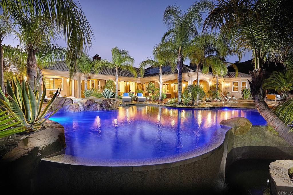 a view of a swimming pool with sitting area