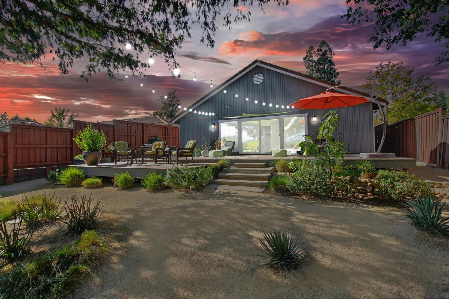 a view of a house with a yard porch and sitting area