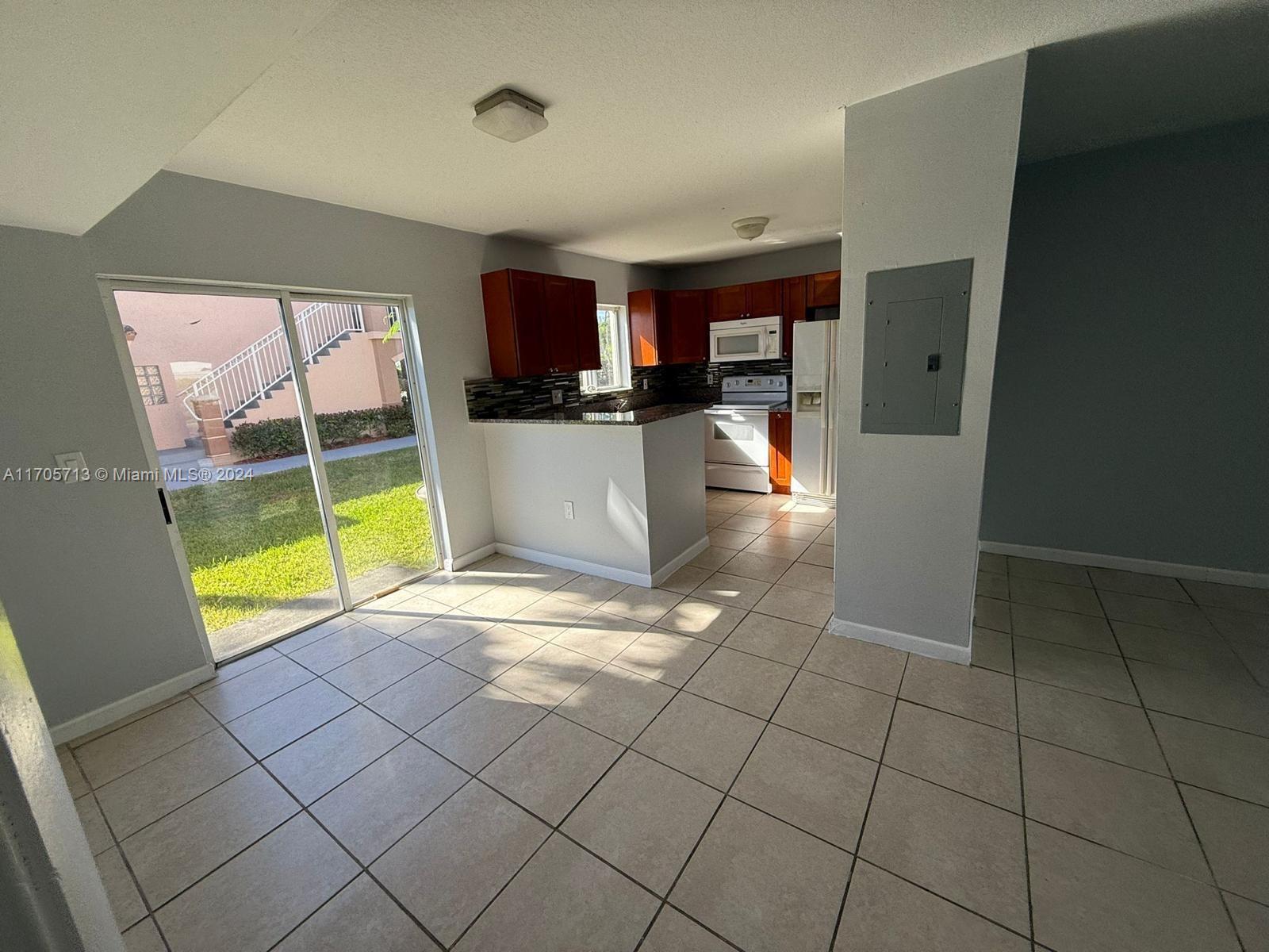 a view of a kitchen with furniture and a kitchen