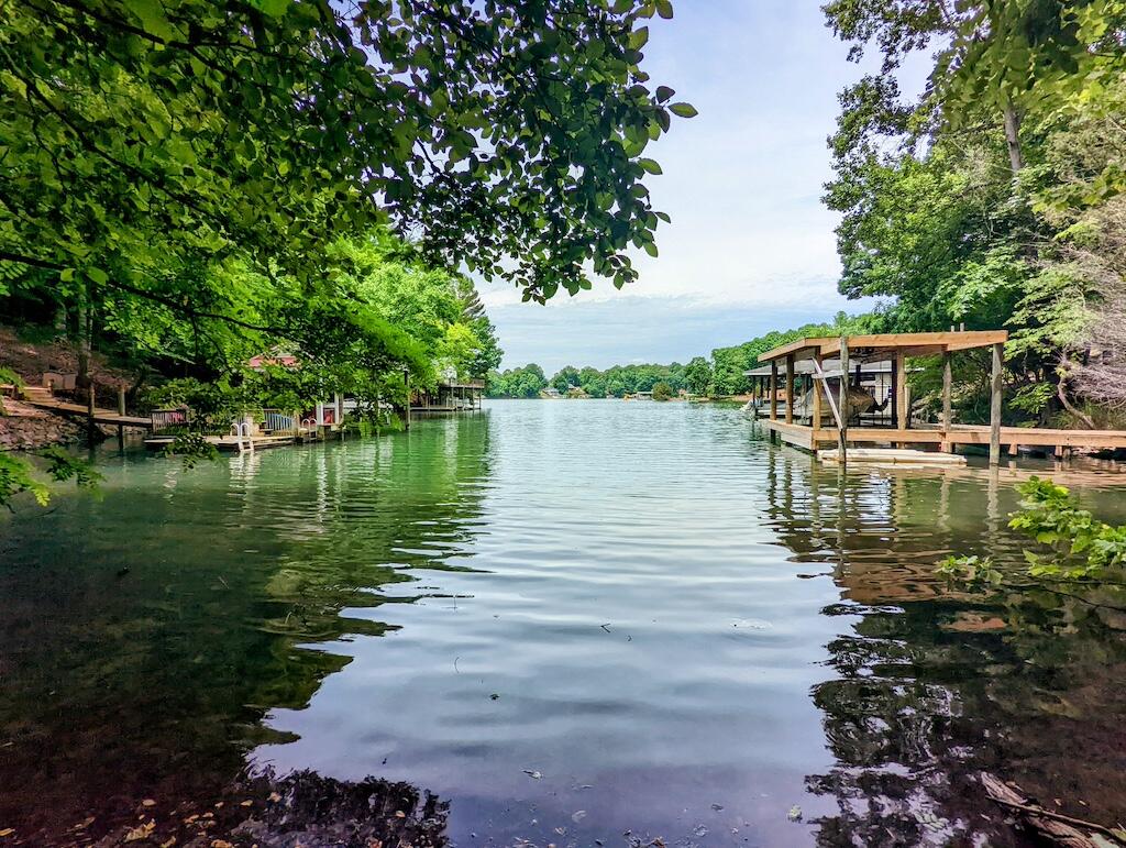 a view of a lake with a house in the background