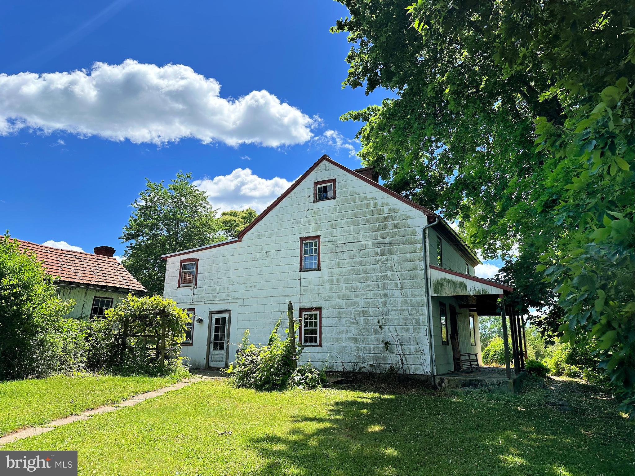 a view of a house with garden and yard