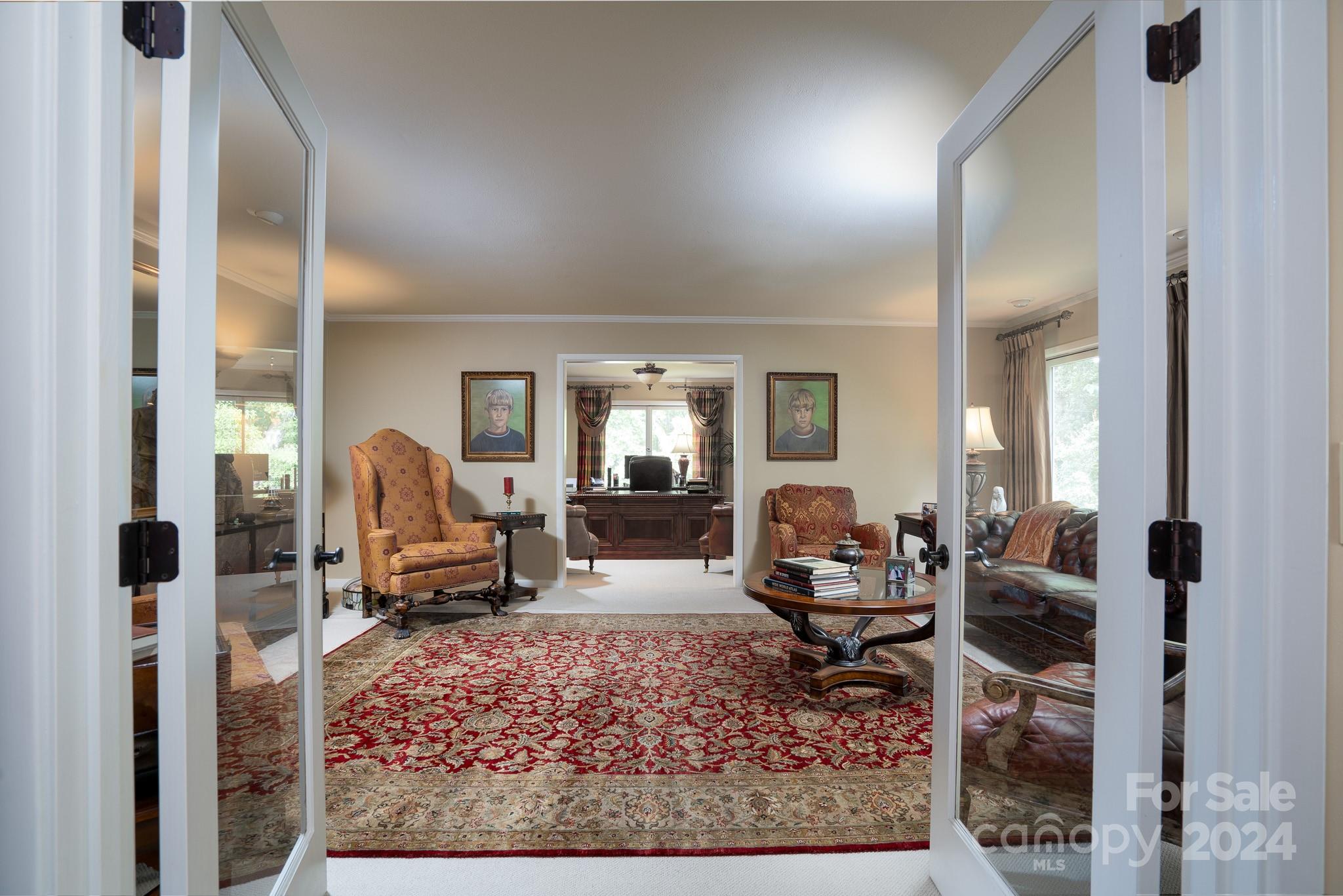 a living room with furniture and a rug