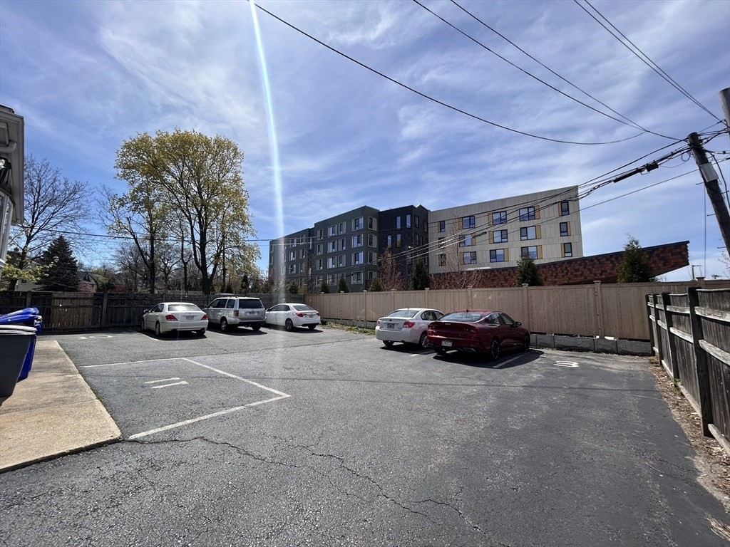 a view of a cars parked in front of a building