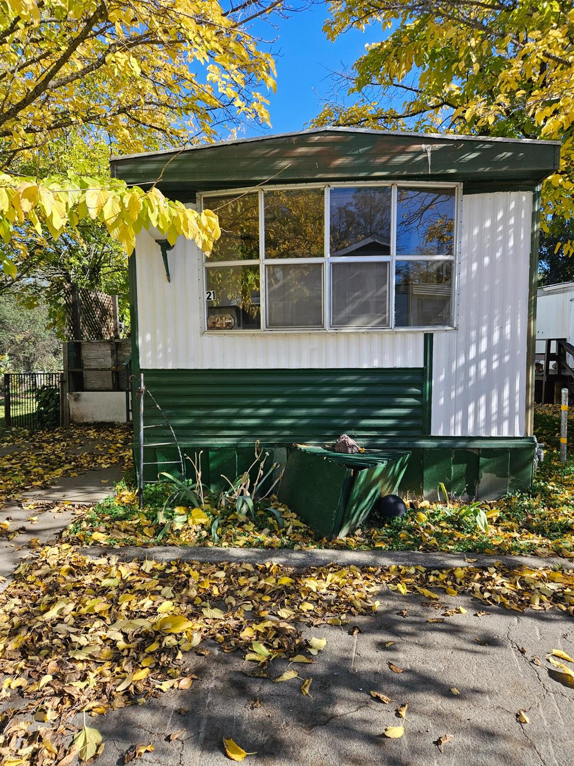 a view of a wooden door with a bench in front of it