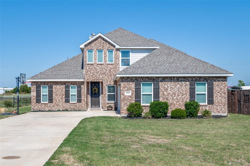 front view of a house with a yard