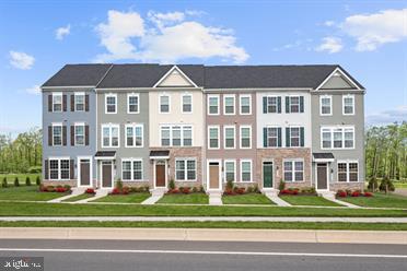 a view of a big yard in front of a brick building