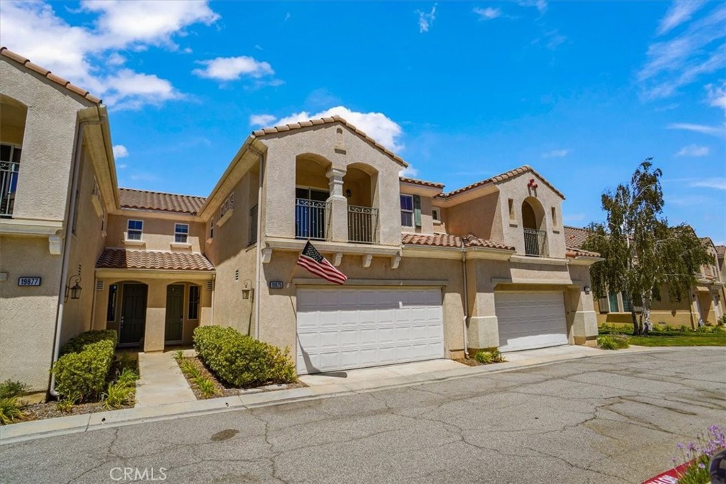 a front view of a house with a garage