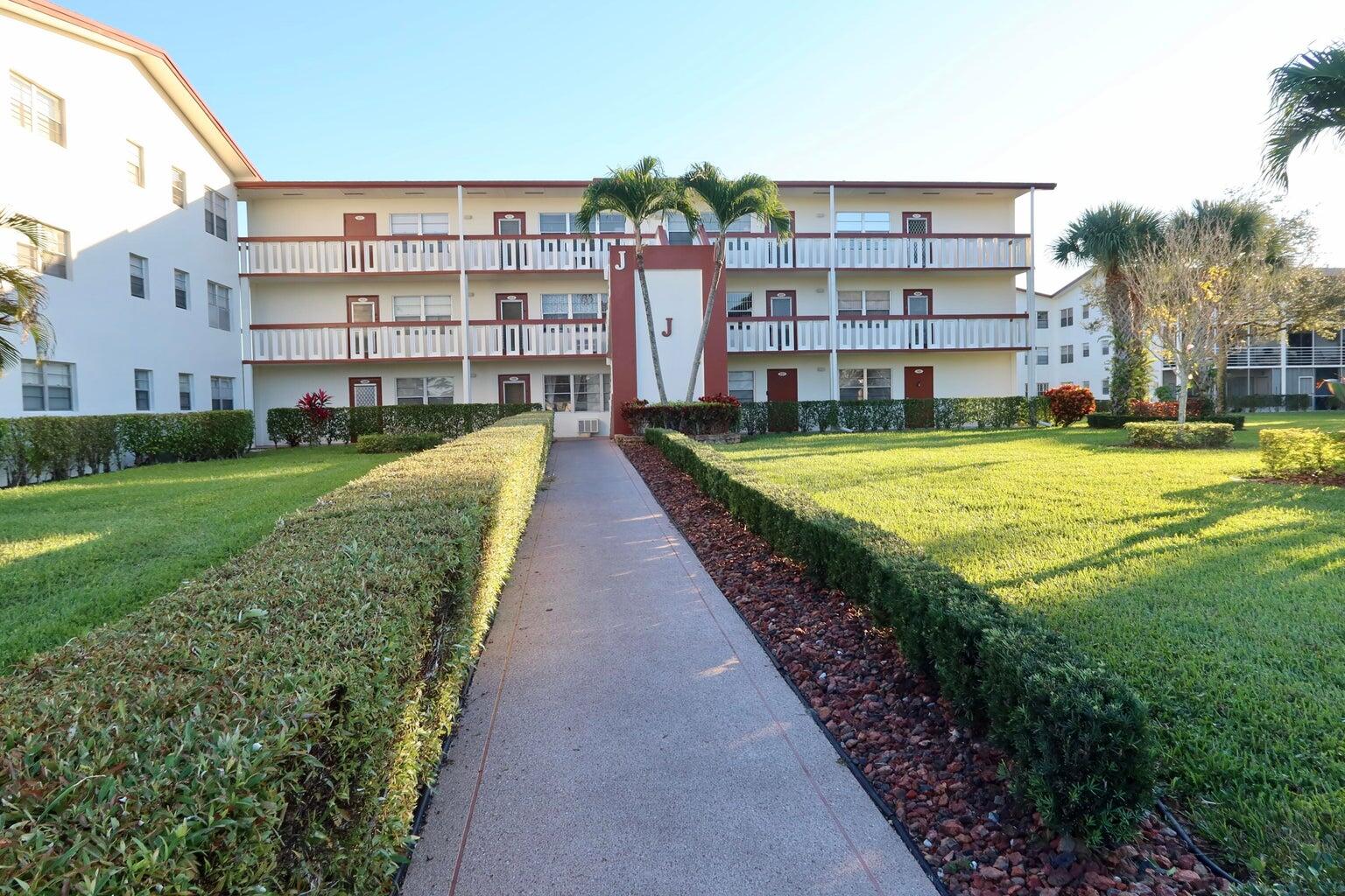 a view of a building with a yard