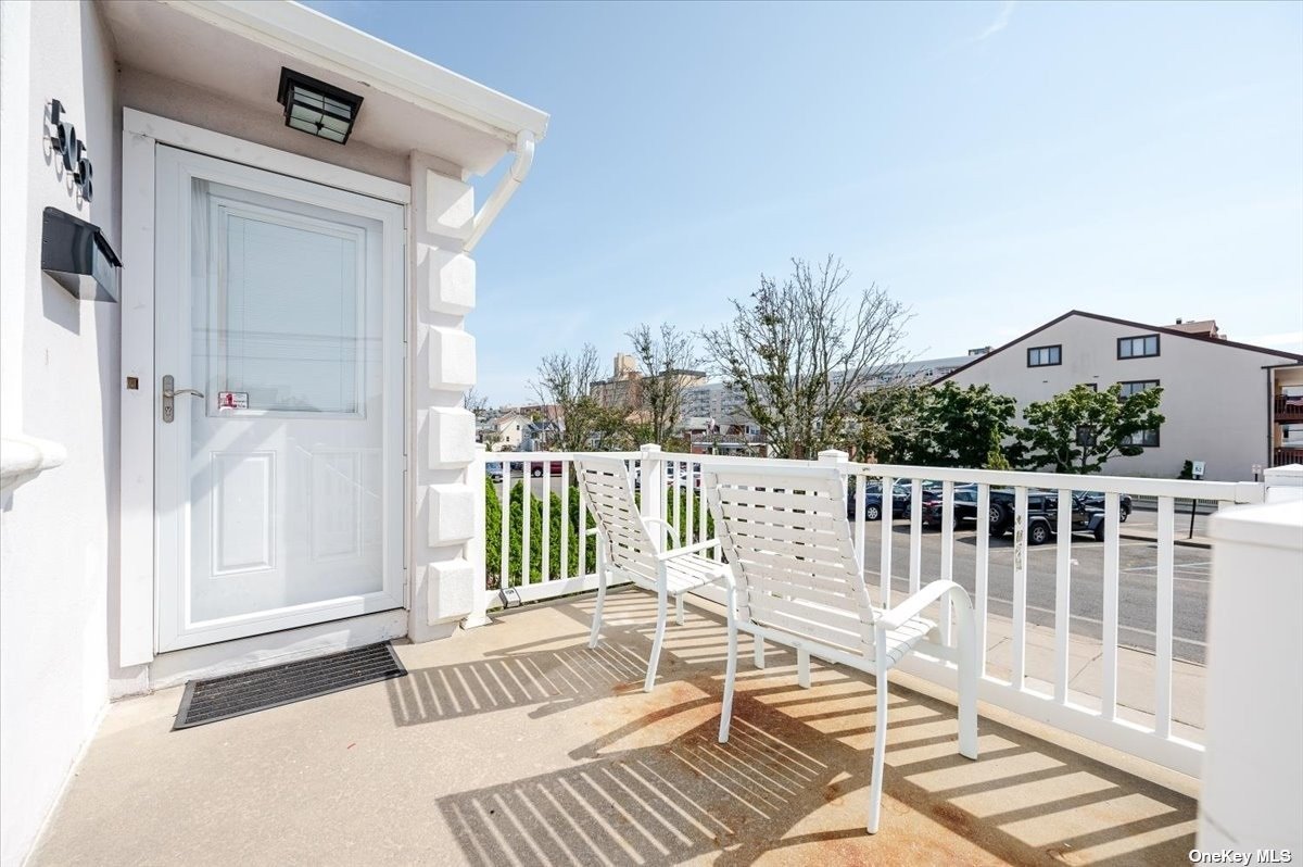 a view of a balcony with wooden floor