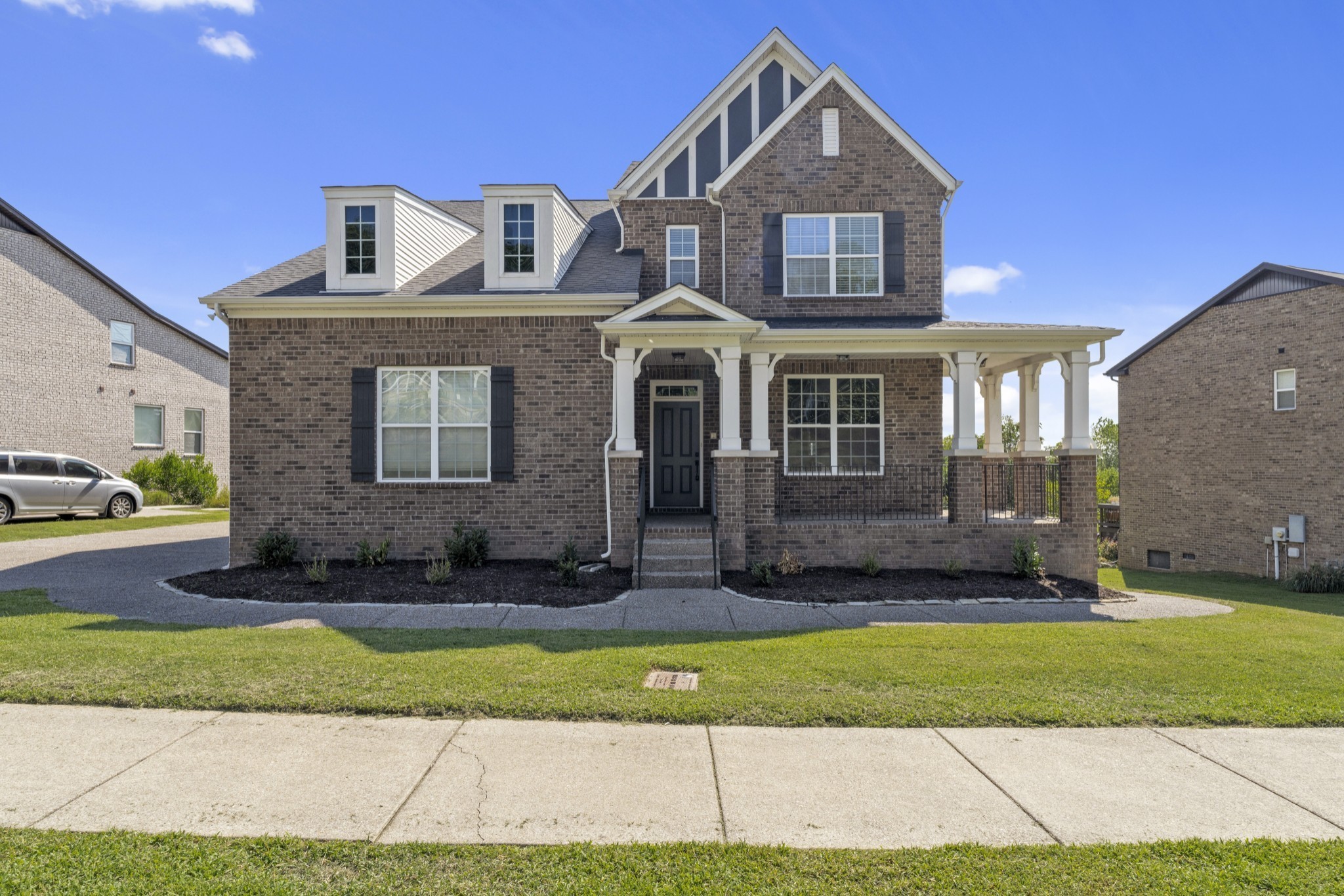 a front view of a house with a yard