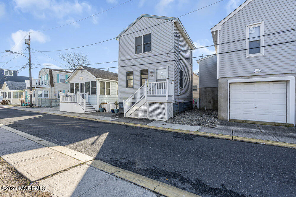 a view of a house with a street