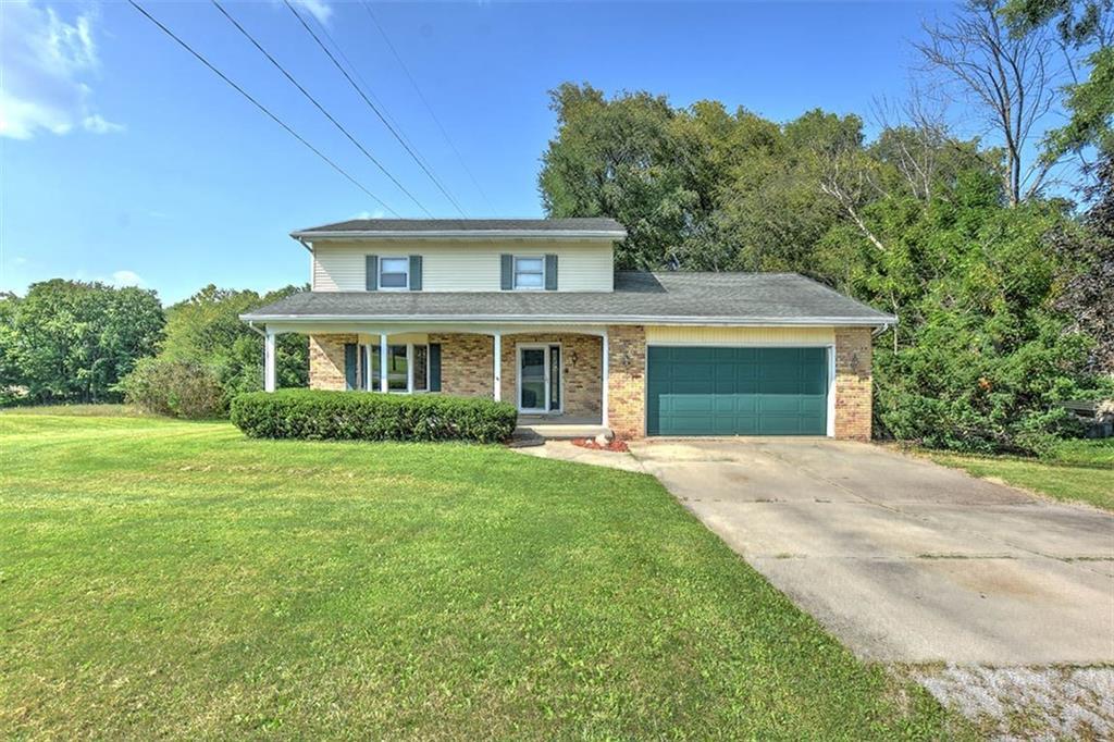 front view of a house with a garden