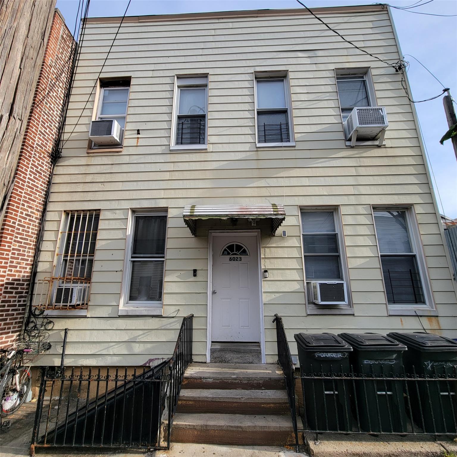 a front view of a house with stairs