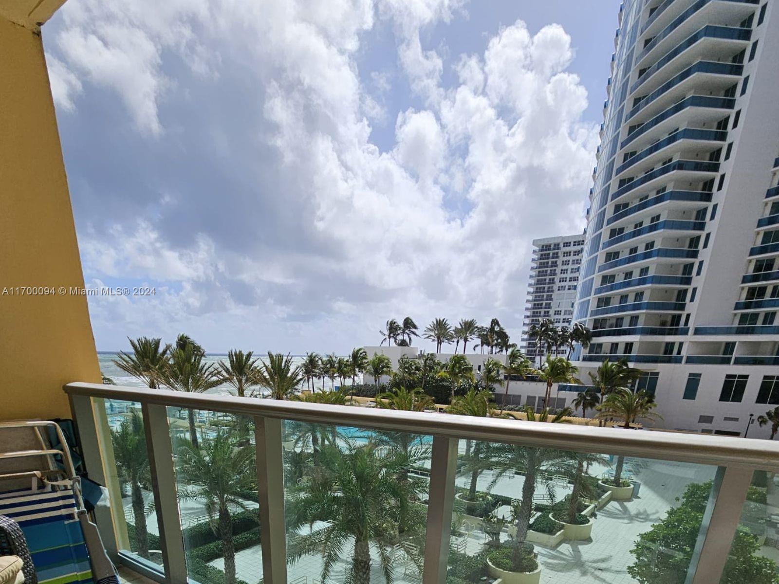 a view of a balcony with an outdoor space