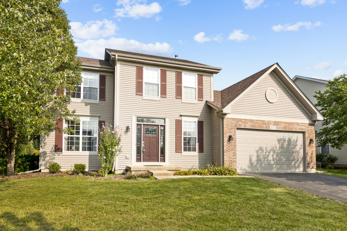 front view of a house with a yard