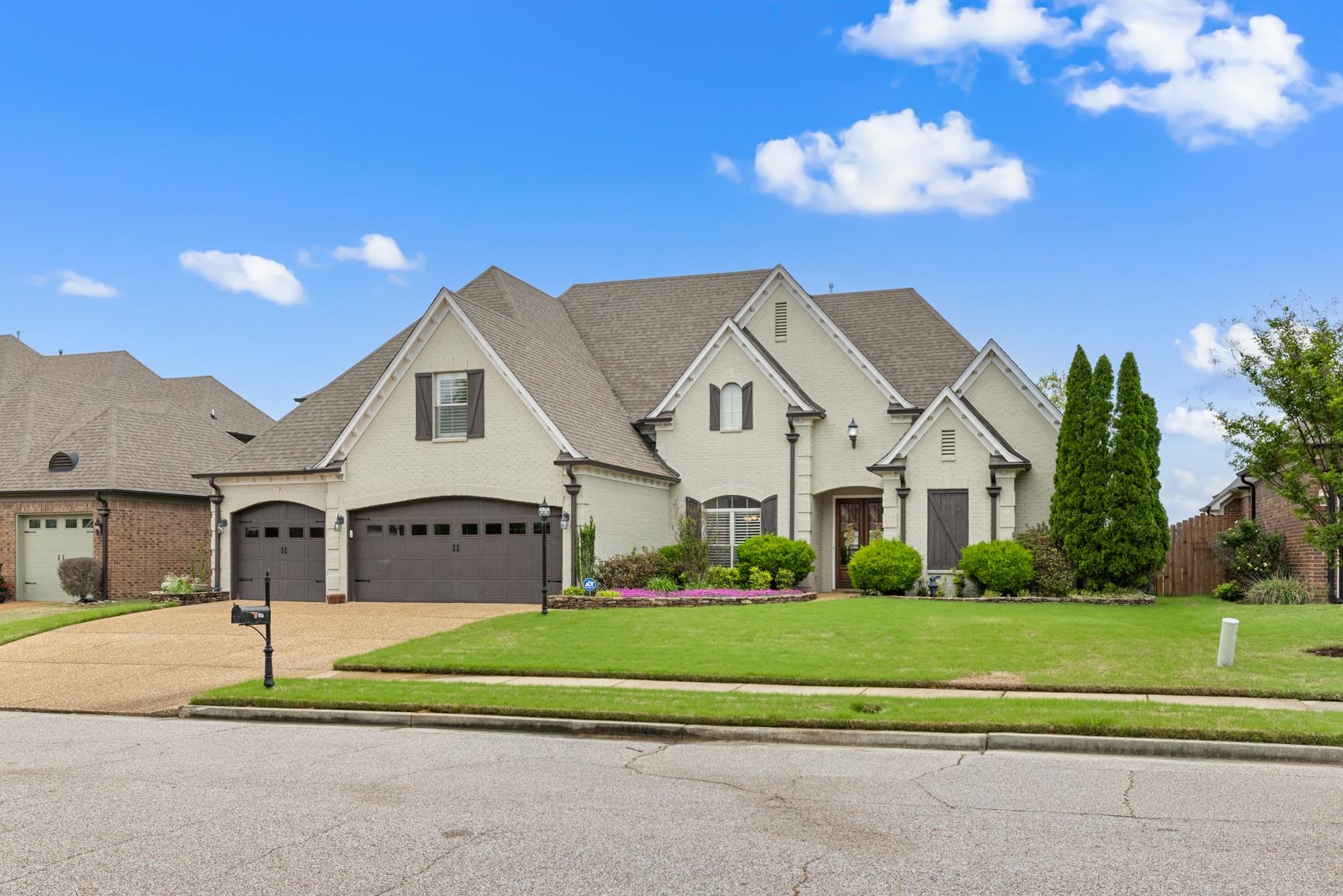 a front view of a house with a yard