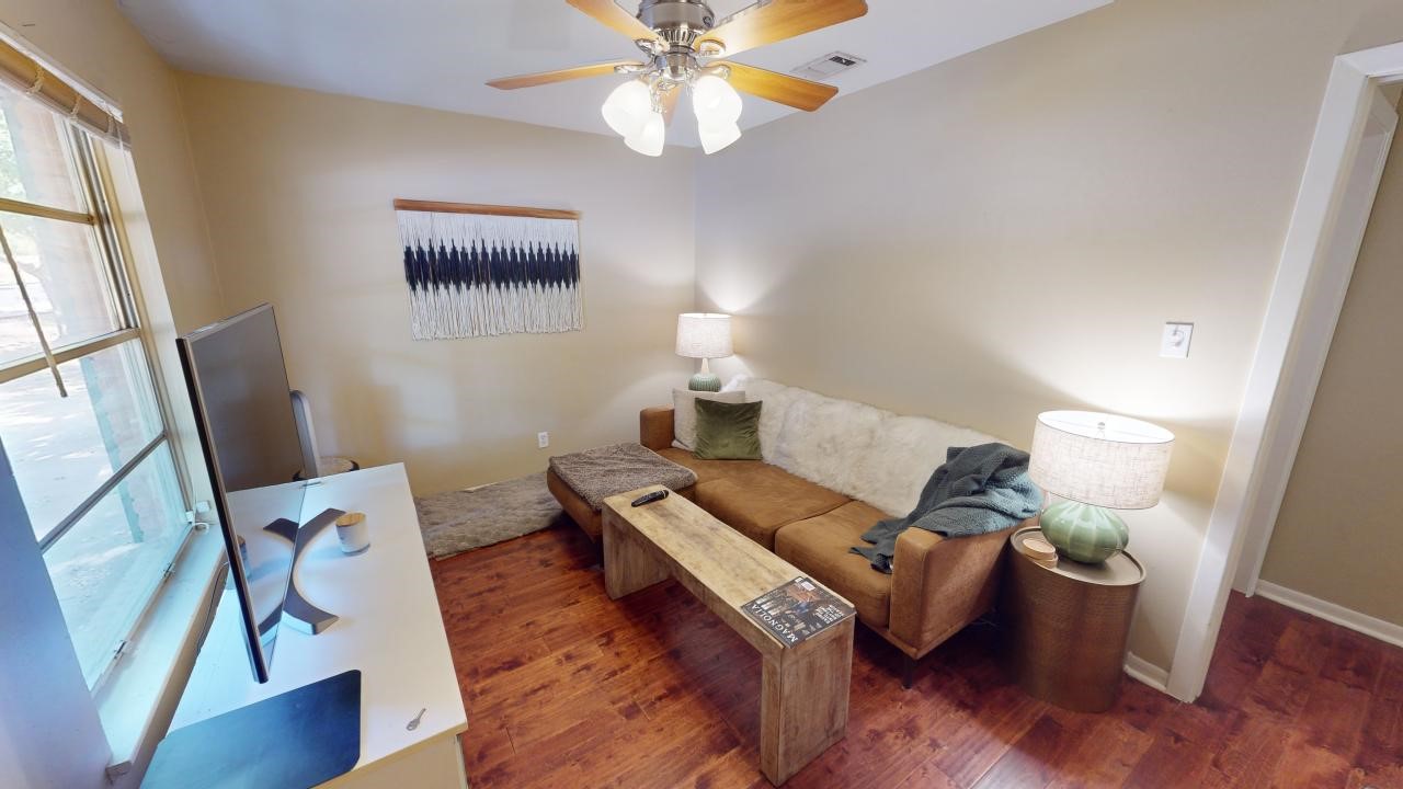 a living room with furniture and a window