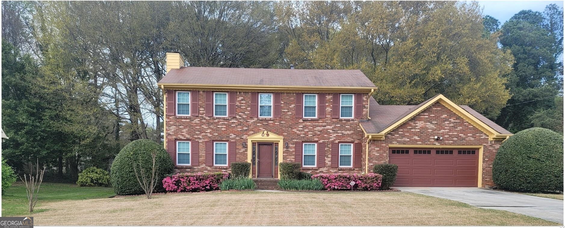 front view of a house with a yard