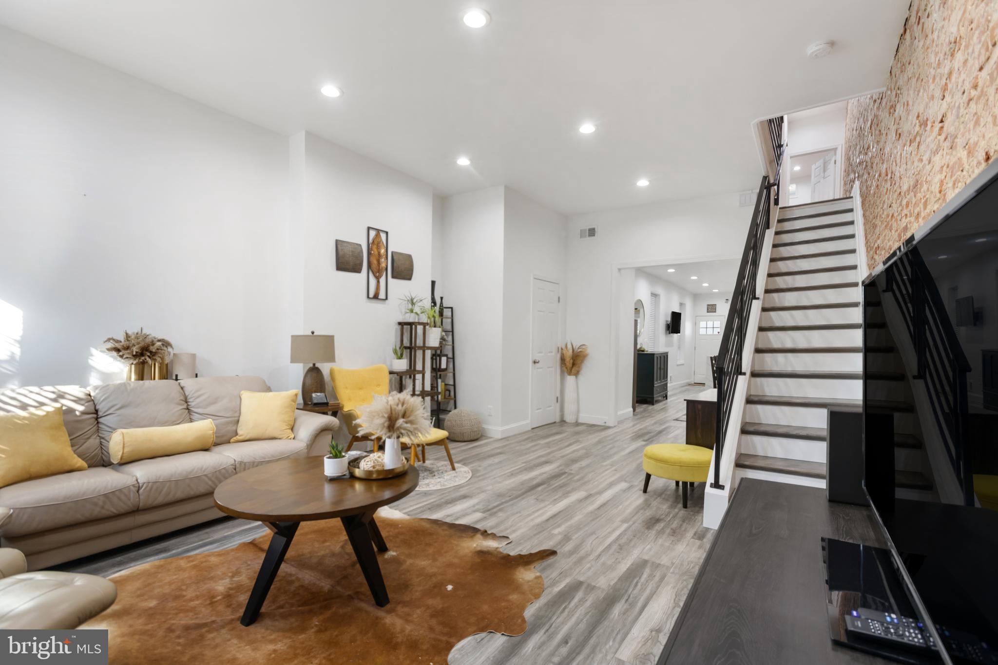 a living room with furniture and a rug