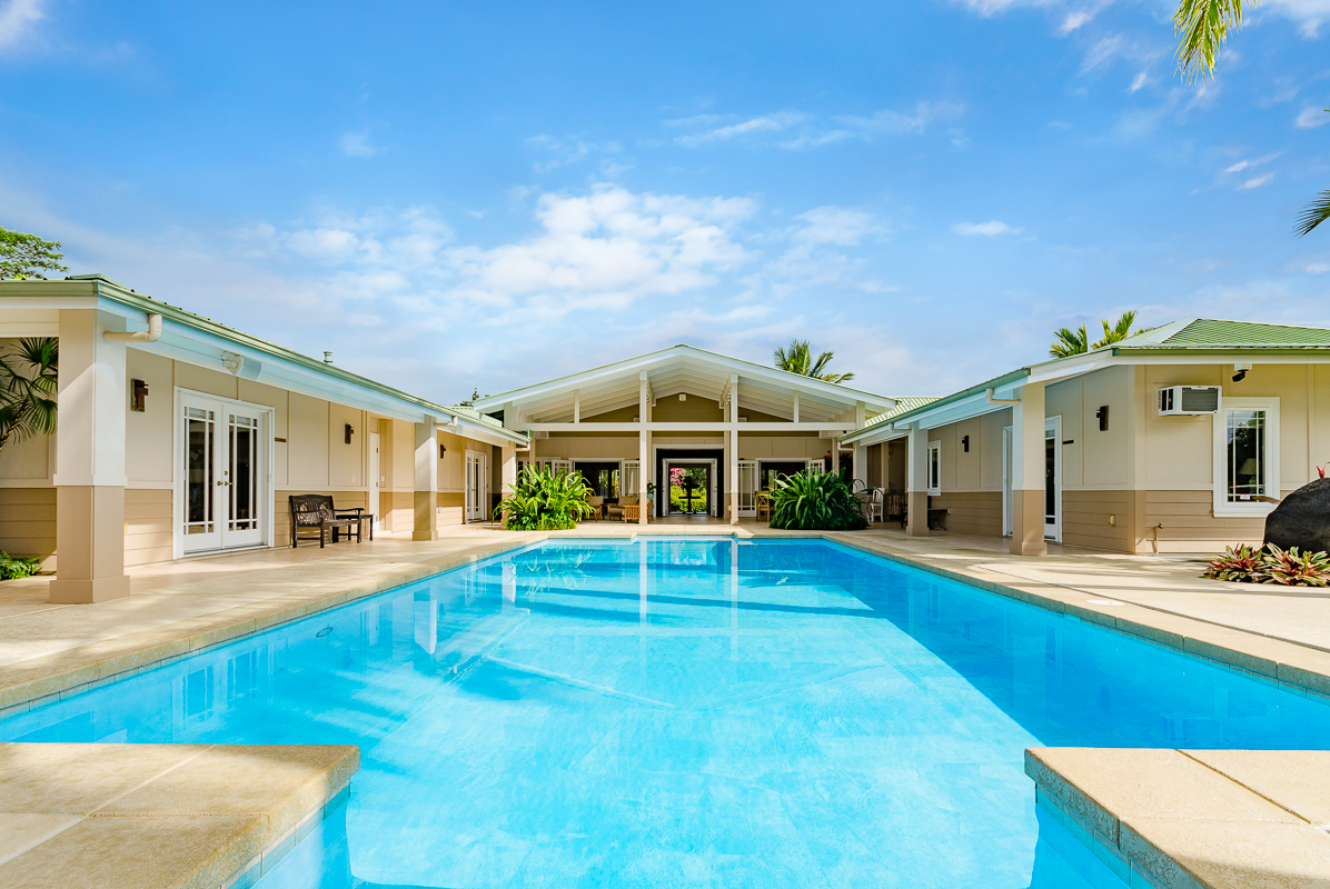 a view of a house with swimming pool and porch