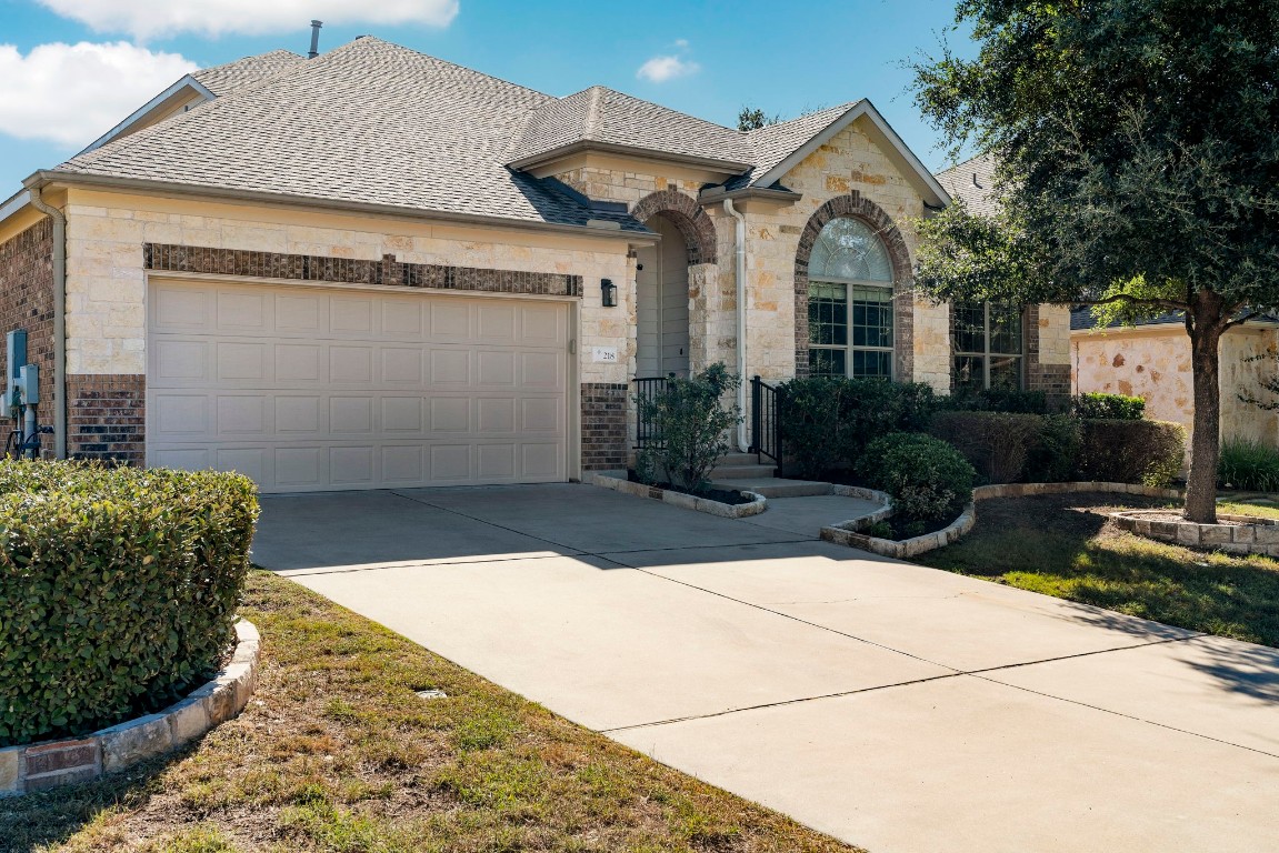 a front view of a house with garden